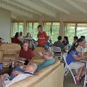 Group in hospitality suite at lodge.<br />